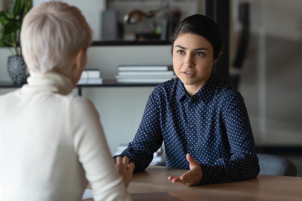 Indian applicant and caucasian HR manager communication during job interview